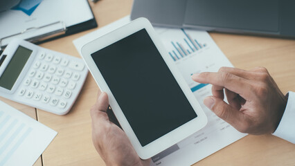 Business concept. Business people discussing the charts and graphs showing the results of their successful teamwork.