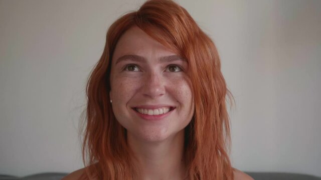 Attractive young girl with red hair. Shows different emotions