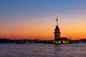 Fototapeta premium Sunset over Bosphorus with famous Maiden's Tower. Istanbul, Turkey