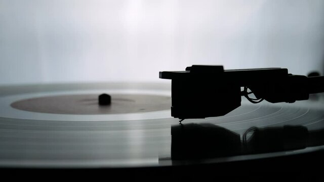 spinning record player with vintage vinyl turntable player and vinyl