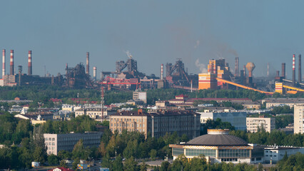 plant that pollutes the atmosphere with smoke and smog