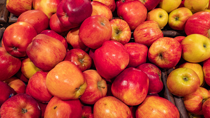 background of red apples for sale in a market or store