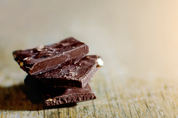 pieces of chocolate with nuts. Close-up, selective focus.