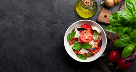Caprese salad with fresh tomatoes, garden basil and mozzarella cheese