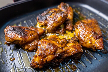 Indonesian Traditional Chicken Grilled on Top of Skillet