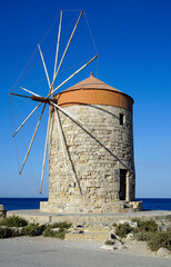 Fototapeta na wymiar famous windmills at madraki harbor