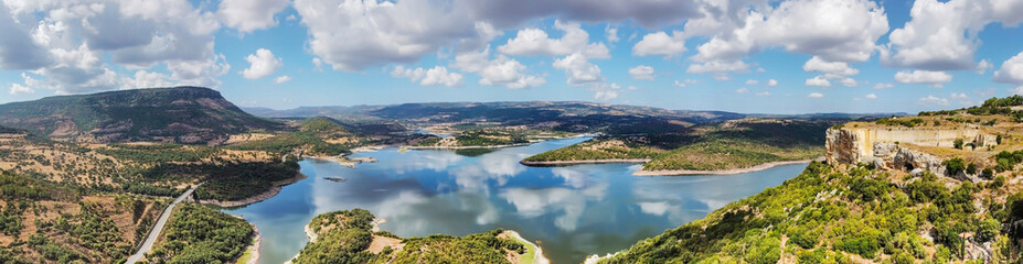 Fototapeta na wymiar Panoramic view of Temo lake under a cloudy sky
