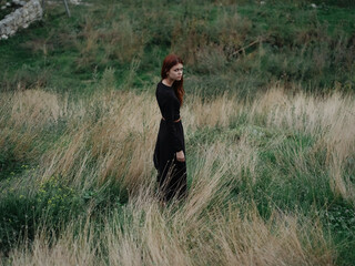 Woman in black dress nature right travel mountains