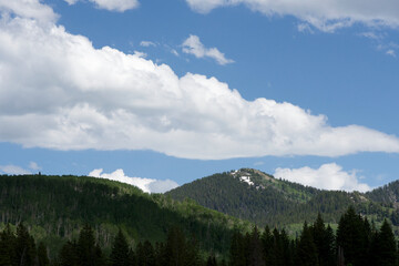 Fototapeta premium Wasatch mountains of Utah in the light and shadow of overhead clouds