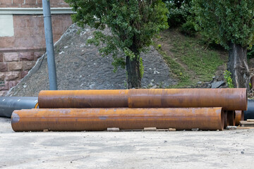 Big rusty water pipes on construction site