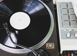 DJ playing music at a hip hop party. analog turntable, Dj uses turntable and mixer for scratching.