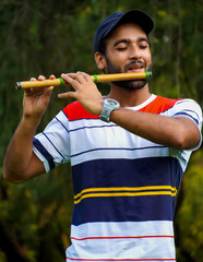playing bansuri flute indian wind instrument © FireFXStudio