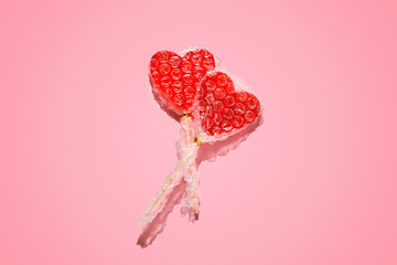 The two lollipop hearts are wrapped in bubble wrap. Creative concept of love.