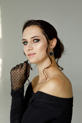 Young woman with smoky eyes makeup in studio in studio