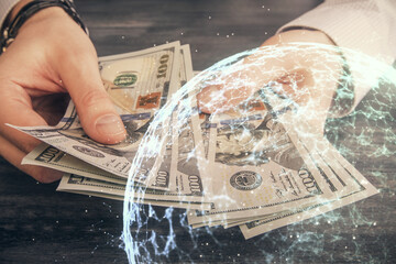 Multi exposure of social network theme drawing hologram and USA dollars bills and man hands.