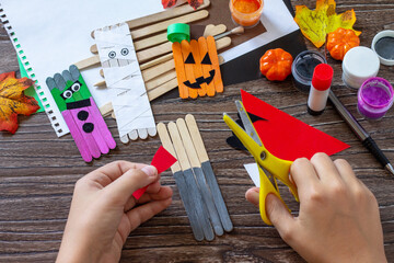 Instructions, step 5. Halloween ghost and vampire toy gift stics puppets on wooden table. Handmade....