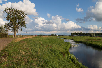 Small river in the rural polder landscape near the village of Eemnes in the Netherlands.