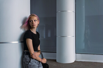 portrait of a teenage girl on an urban background