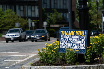 Andover, MA, US-June 2, 2020: Sign along side of busy street reading "Thank you! Nurses, Doctors, Firefighters, Police, First Responders,  Grocery Workers" etc. during the era of the Covid-19 pandemic