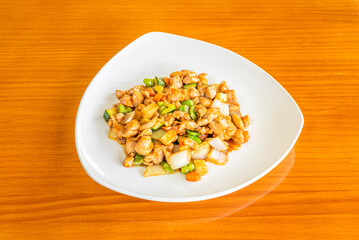 Delicious Chinese Chopped Chicken Stew Recipe with Peppers, Carrots, Zucchini and Chopped Onions on White Plate