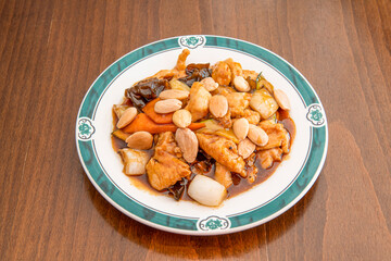 Chicken stew with whole almonds, wok-stewed carrots and onions and rehydrated Chinese mushrooms with soy sauce