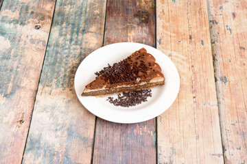 delicious portion of chocolate cake with various types of chocolate