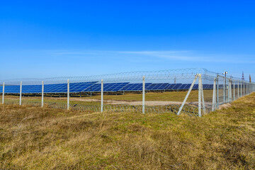 Fototapeta na wymiar Many solar panels in a field. Clean energy. Ecological concept