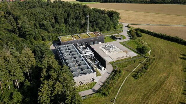 Aerial drone view of geothermal power station producing green renewable energy in germany, 4k and HD