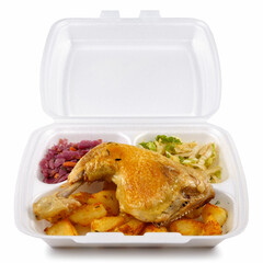 Takeaway food in a disposable polystyrene container, isolated on white