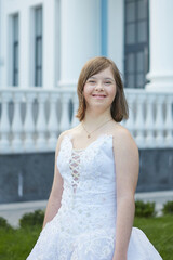 Girl with Down syndrome in  wedding dress.