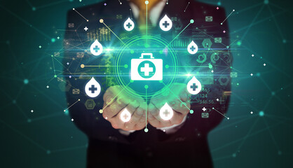 Hand holding healthcare icons concept