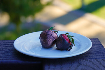 Chocolate covered strawberries on a plate