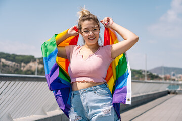 Young woman waving lgbti flag