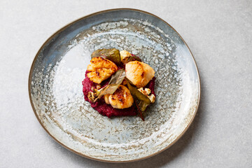 Pan fried scallops with beetroot puree and cauliflower