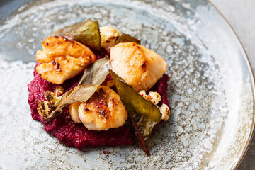 Pan fried scallops with beetroot puree and cauliflower