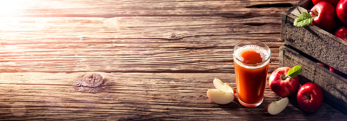 Glass Of Apple Cider On Wooden Table With Apples And Crate - Harvest Time