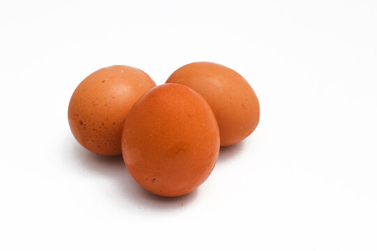 a Group of brown chicken eggs isolated on white background.