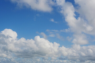Naklejka na ściany i meble Simple blue cloudy sky. Nature background.