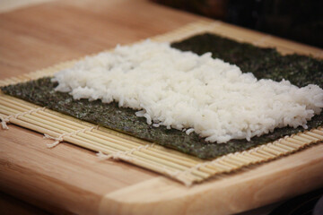 Homemade cucumber sushi roll preparation – in progress 