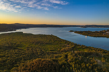 Late afternoon aerial waterscape over the bay with high clouds