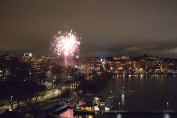 Fireworks at Kungsholmen waterfront at night, Stockholm, Sweden.