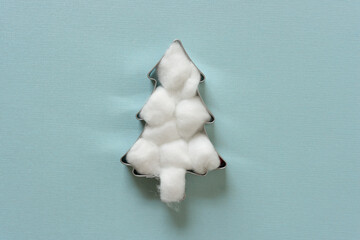cotton ball christmas tree on blue with space