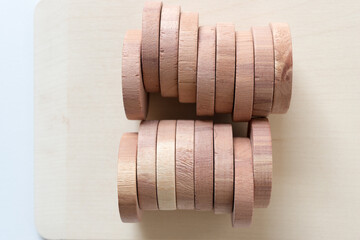 two rows of hanger rings on wood