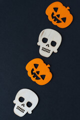 halloween jack o lanterns and skulls on a black background