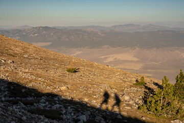 Hiker Shadows on Mountain Ridge
