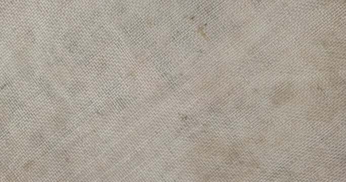 Rotation of the artificial synthetic fabric of the sack. Texture, background. Top view