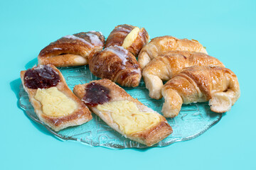 Sweet bakery products, with sugar, pastry cream and quince paste on green background