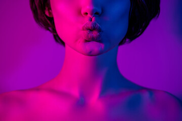 Cropped photo calm girl with nude shoulders sending air kiss pouted lips isolated neon color...