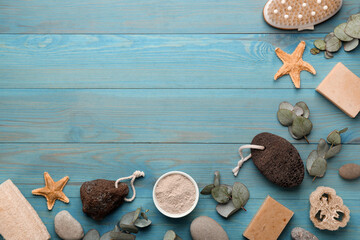 Flat lay composition with pumice stones on turquoise wooden background. Space for text