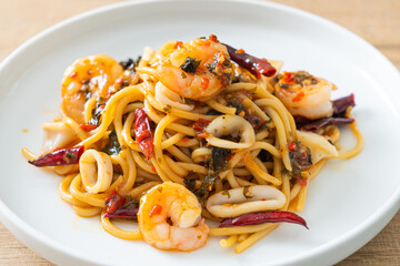 spicy spaghetti seafood on plate